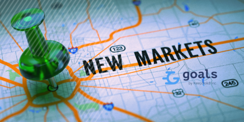 New Markets Concept - Green Pushpin on a Map Background with Selective Focus.